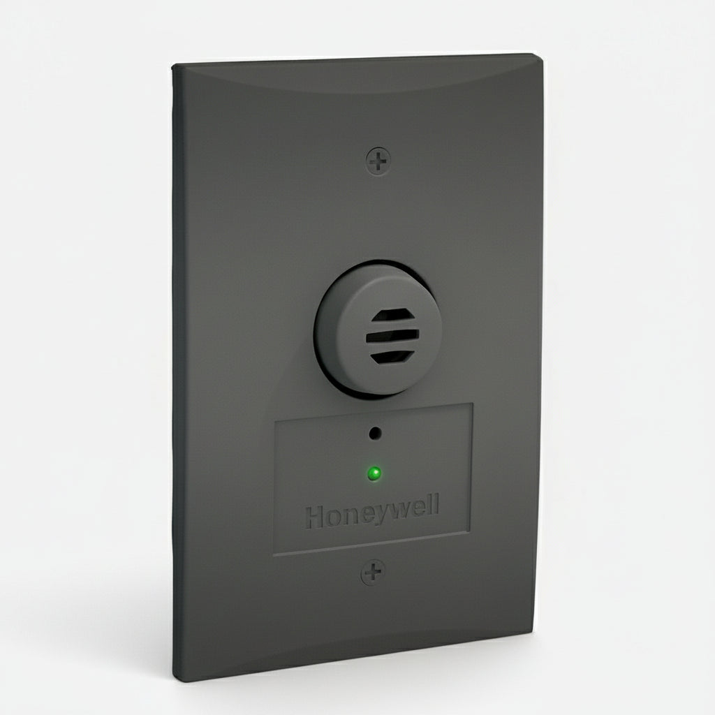 Honeywell wall-mounted device with a green indicator light on a white background