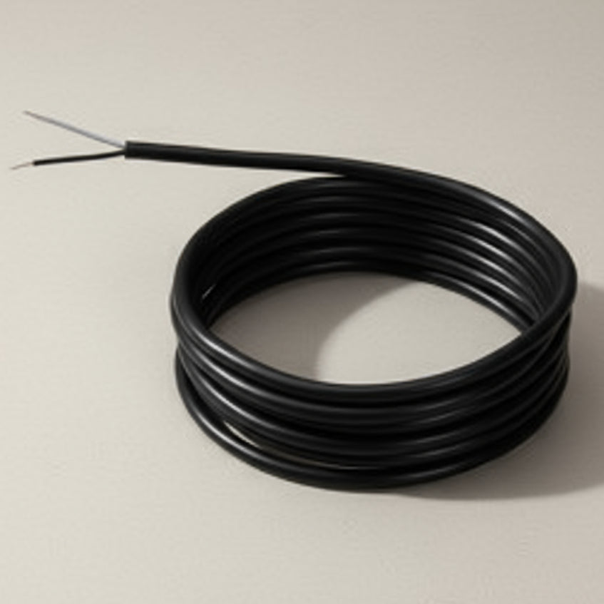 Coiled cable with a metal probe on a white background
