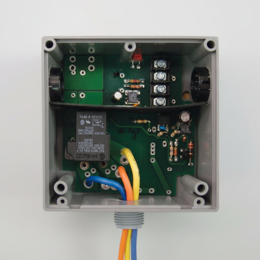 Electronic control box with wiring on a white background