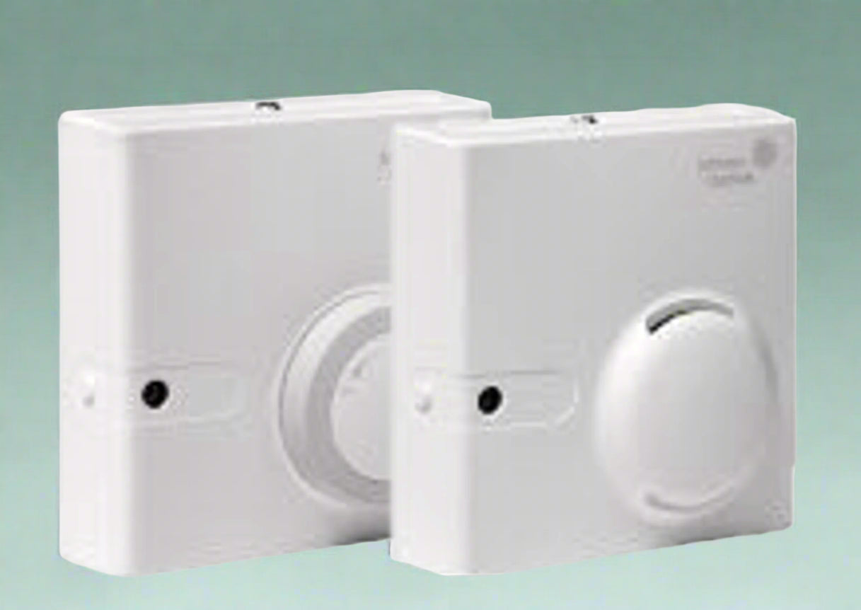 Johnson Controls branded, White humidistats on a green background