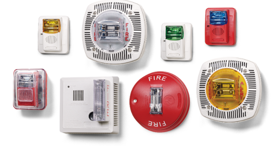 Assorted white and red smoke alarm detection devices on a white background 