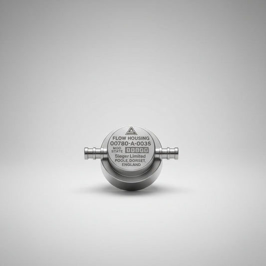 Flow housing component in clear packaging on a white background