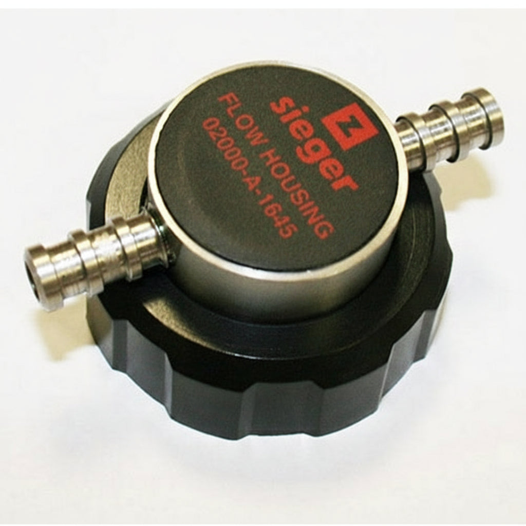 Honeywell (Sieger) flow housing with brass connectors on a white background