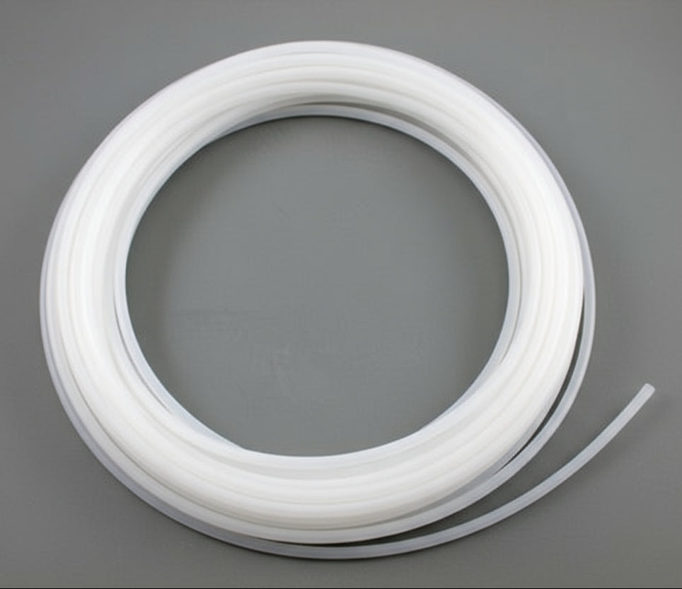 wound white plastic tubing roll, 100 ft on gray background