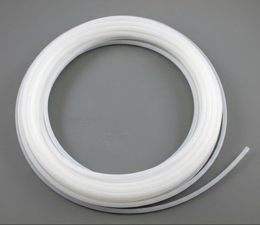 wound white plastic tubing roll, 100 ft on gray background