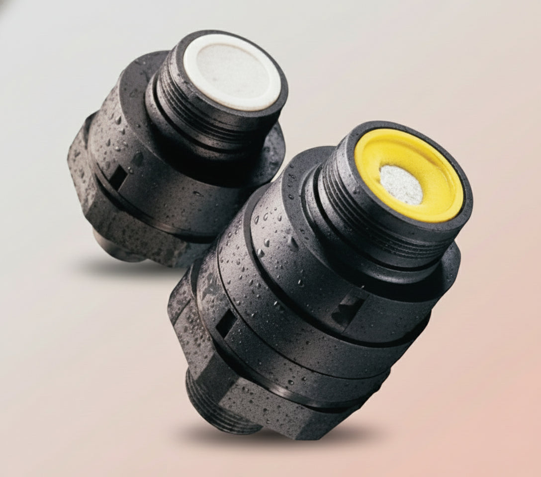 Two black mechanical components with threaded connections on a white background