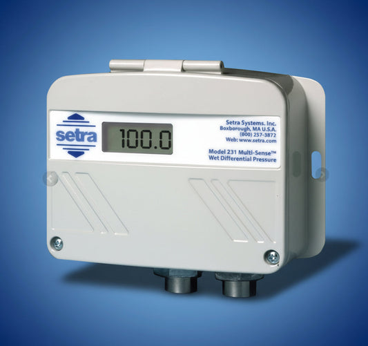 Setra differential pressure sensor with digital display on a blue background