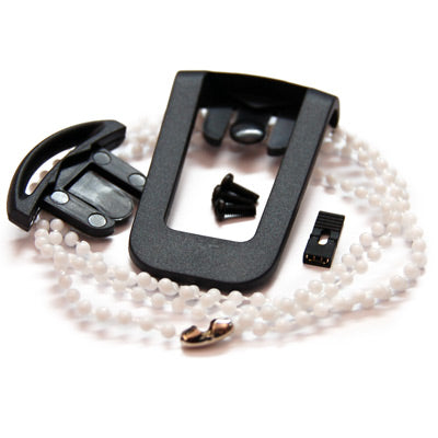 Black metal and plastic components and white necklace on a white background