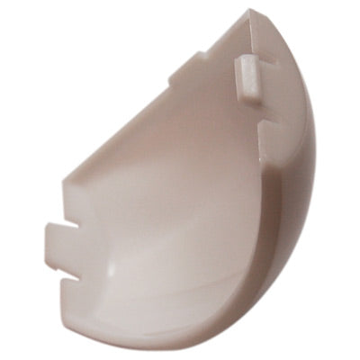 Beige plastic component on a white background