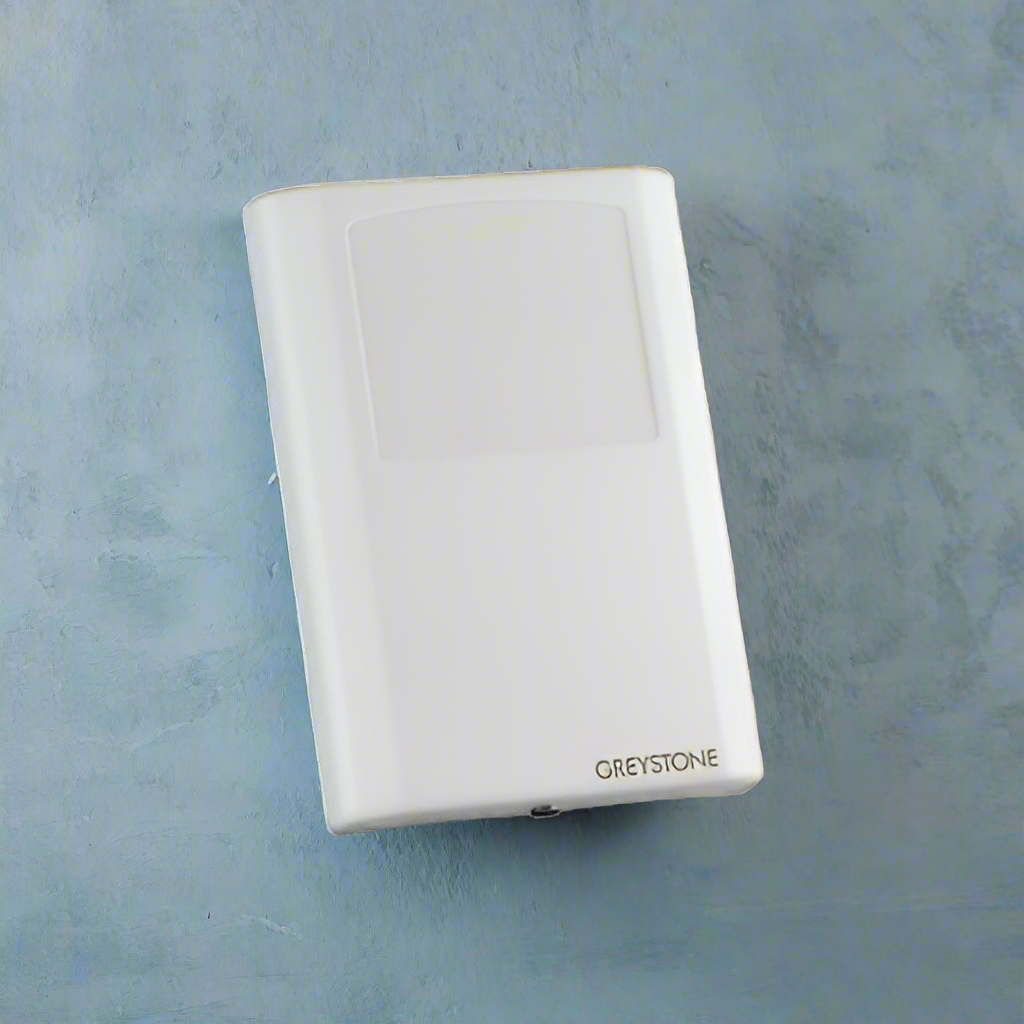 White electronic device with 'Greystone' branding on a light blue background