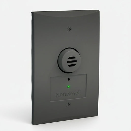 Honeywell wall-mounted device with a green indicator light on a white background