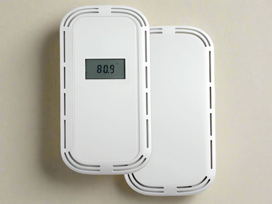 White electronic device with digital display on a light background