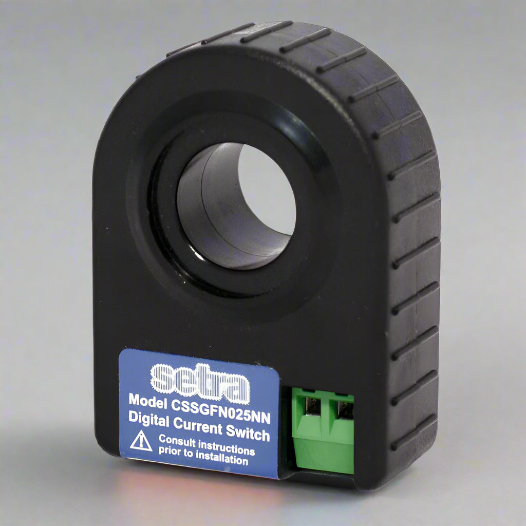 Setra-branded black plastic current switch with opening on a gray background