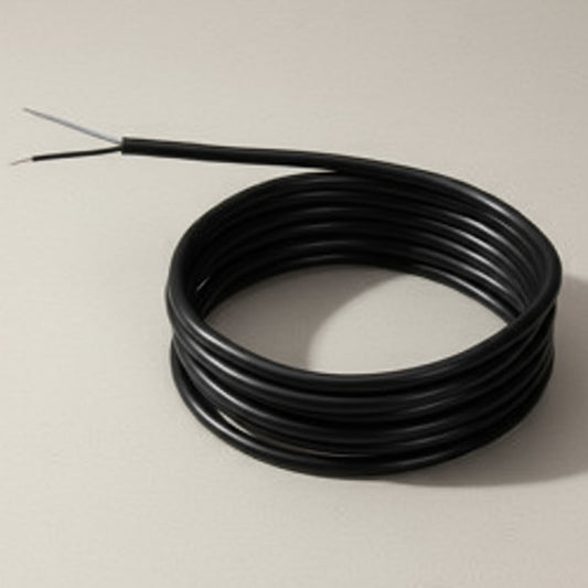 Coiled cable with a metal probe on a white background