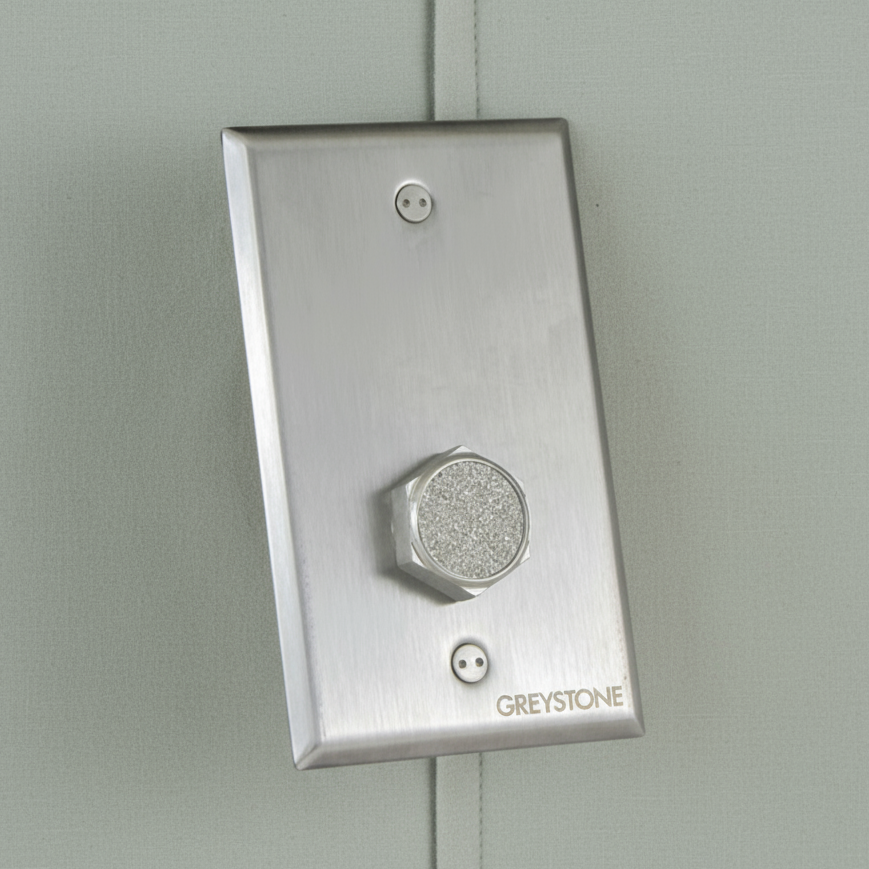 Metallic wall switch with 'Greystone' branding on a light gray background