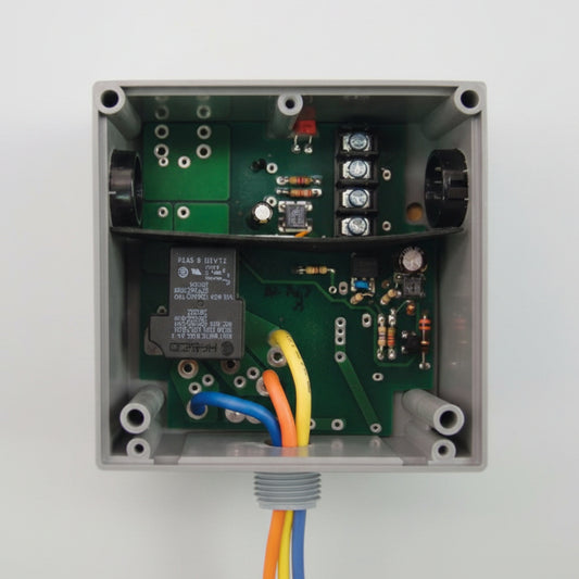 Electronic control box with wiring on a white background