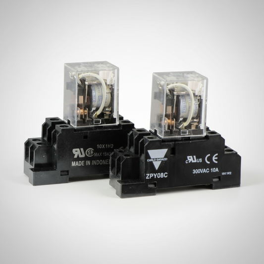 Two electrical relays on a white background