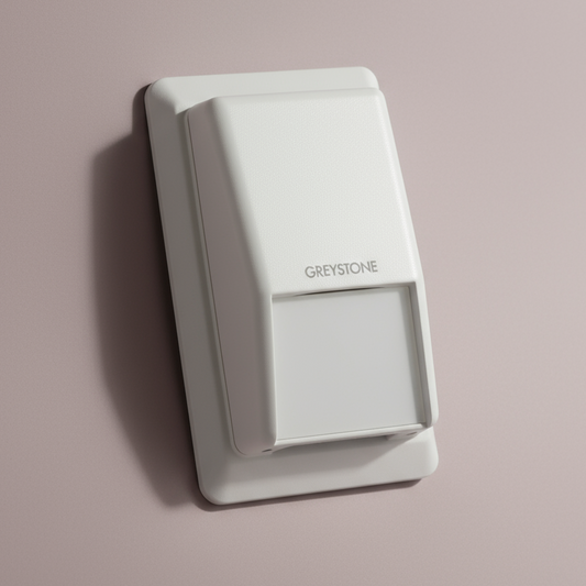 White wall sensor with 'Greystone' branding on a gray background