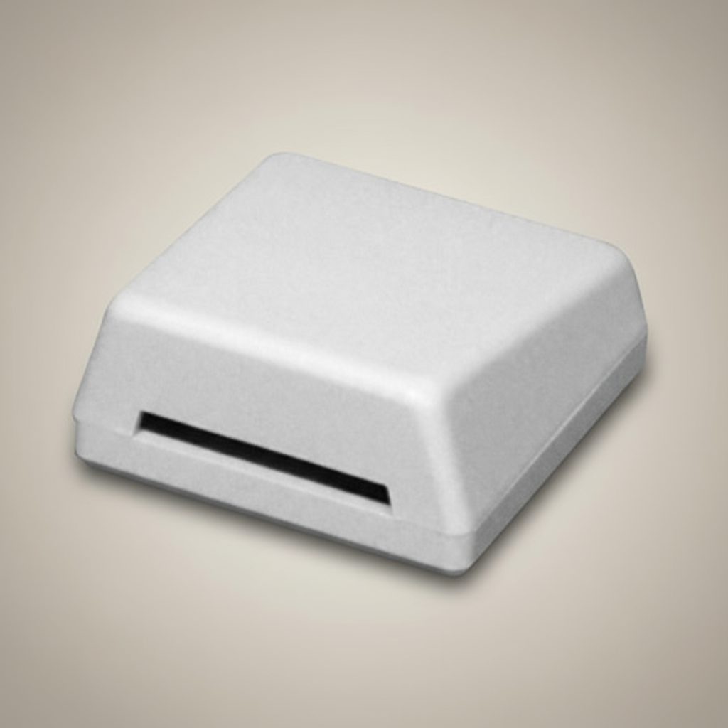 White rectangular object with a slot on a white background
