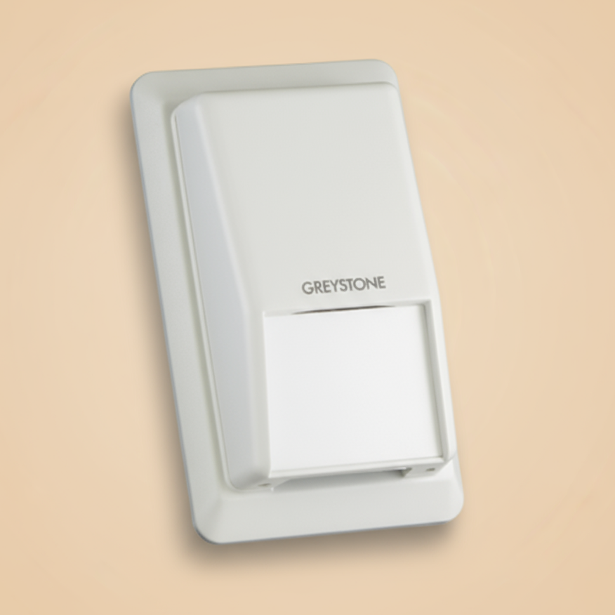 White Greystone wall switch on a beige background