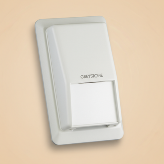 White Greystone wall switch on a beige background