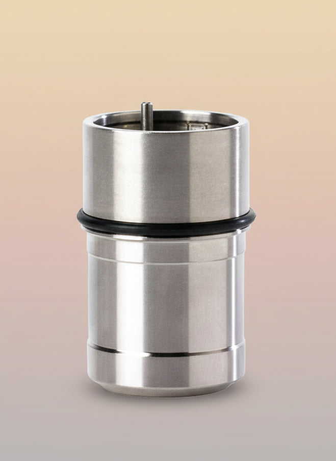Metal cylindrical component with a black rubber sleeve on a white background