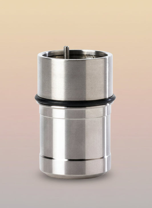 Metal cylindrical component with a black rubber sleeve on a white background