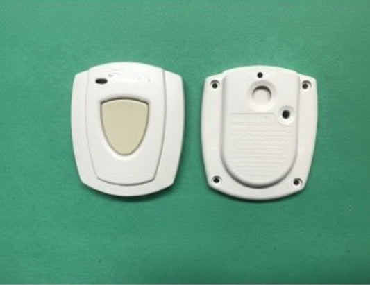 Two electronic devices on a green background with a small label in the center.