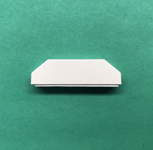 White rectangular object on a green background