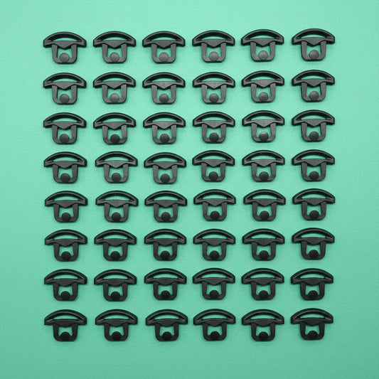 Black clips on a green background