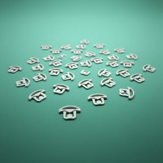 little beige clips on a green background