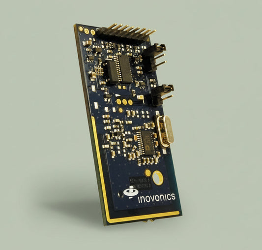 Electronic module with 'inovonics' branding on a white background