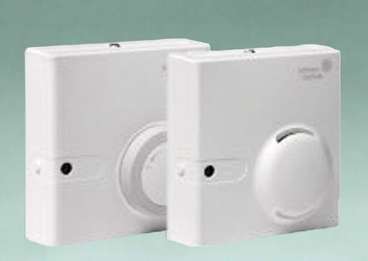 Johnson Controls branded, White humidistats on a green background