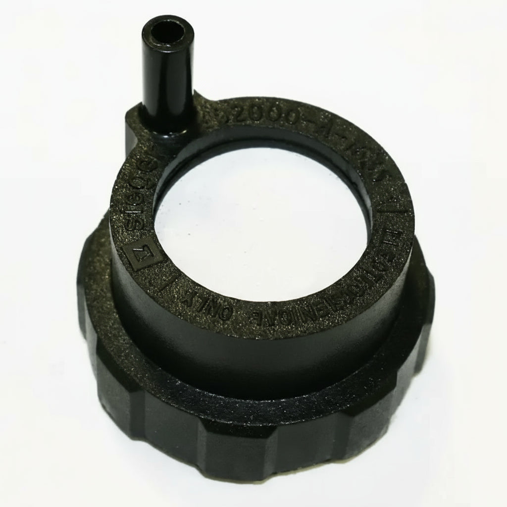 Black rubber gasket with central hole on a white background