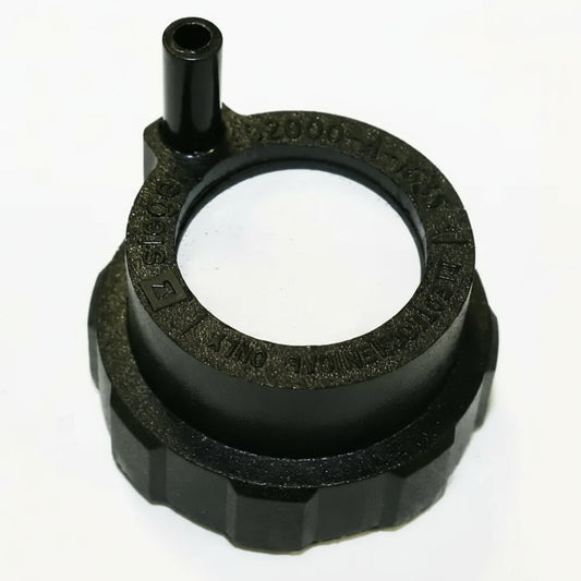 Black rubber gasket with central hole on a white background