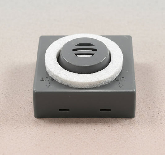 Square device with a circular component on a gray background