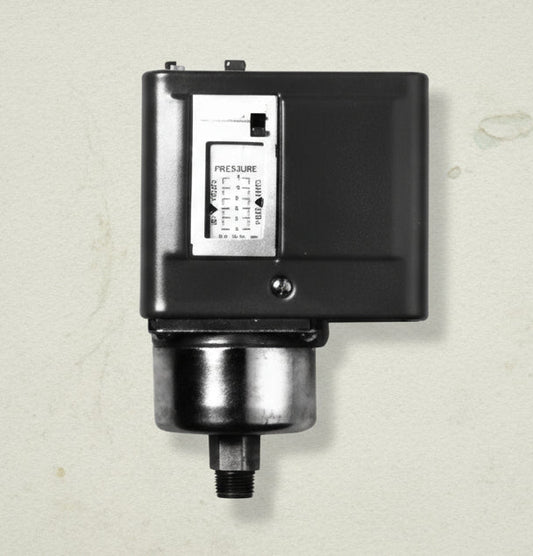 Black mechanical device with a digital display on a white background