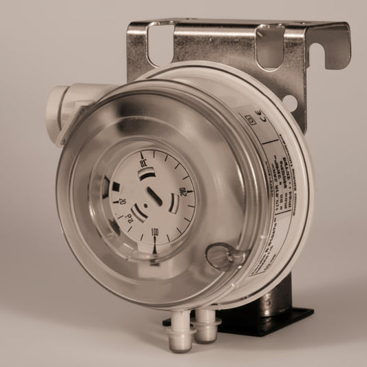 Mechanical device with a circular component and metal bracket on a white background