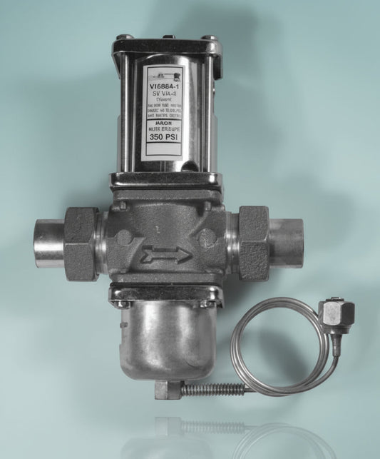 Metal valve with a label on a gray background